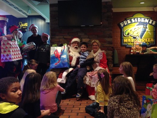 Springfield area children participating in the Big Brothers Big Sisters program visit with Santa last December at Chili's Restaurant. City wide, there are about 308 kids in the Big Brothers and Big Sisters program, according to program employee Chelsea Foresee.