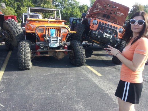 Middle College science teacher Stephanie Blake takes a moment to admire some of the unique vehicles on display at the ANPAC Car Show in September.  Blake contemplated owning her own modified Jeep Wrangler one day after attending the show.