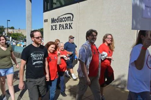 Gretchen and Shawn Teague (center and right) participate in the walk to defeat ALS. Gretchen’s daughter lost her battle to ALS in September 2009.