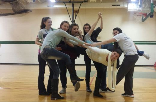 Teacher Stephanie Blake receives support from the Vikettes dance team in the small gym at Parkview H.S. Blake has led the dance team at Parkview for 12 years.