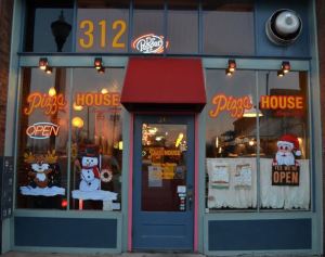 A decorative holiday scene fills the windows of Pizza House on Commercial Street. Pizza house has a certificate of excellence and according to Trip Advisor, it is in the top-10 best restaurants in Springfield, MO.